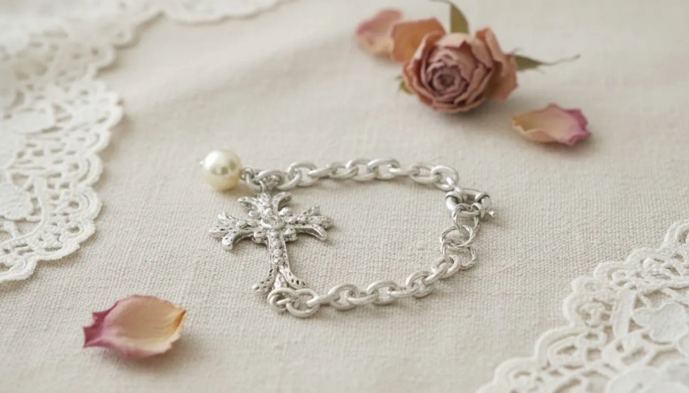 Silver Bracelet with Pearl and Cross Charm sold by Charming Charlie