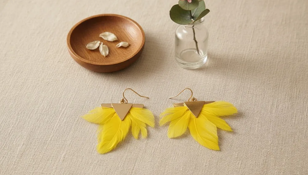Yellow Sky Feather Earrings sold by Charming Charlie