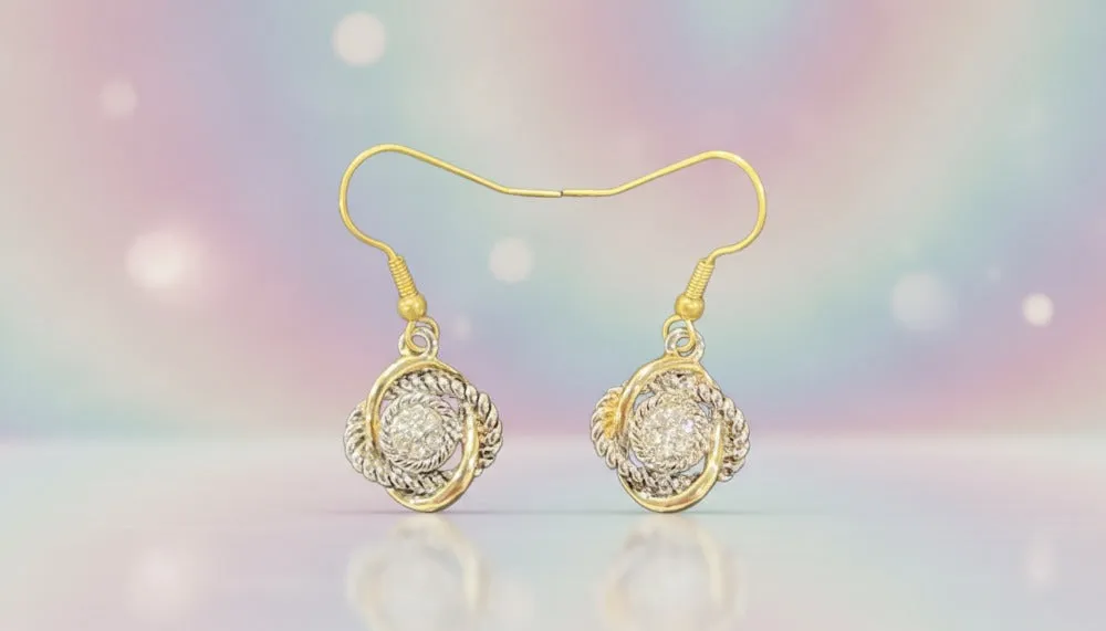 Golden Twirl Spark Earrings sold by Charming Charlie