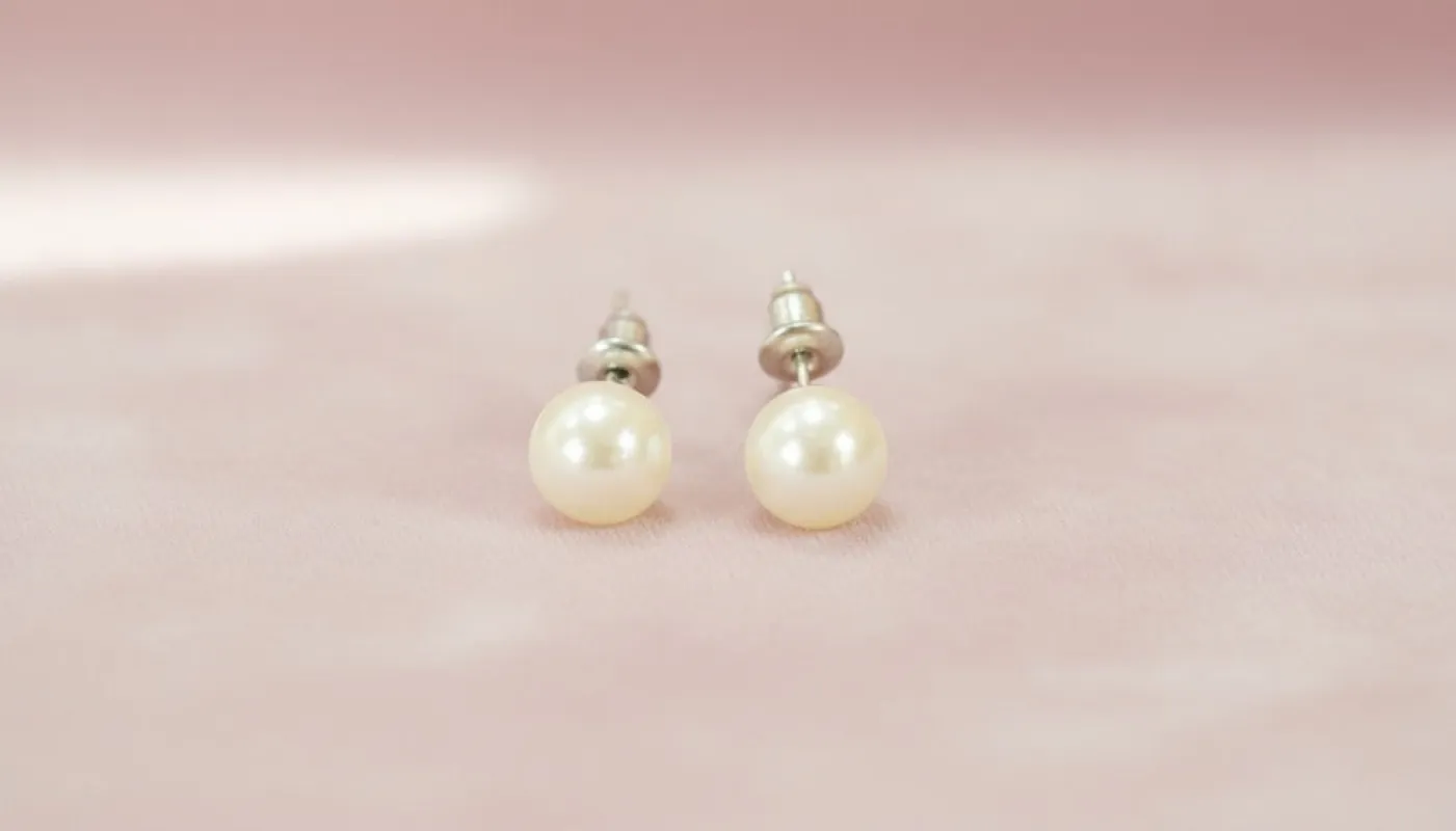 Classic Pearl Stud Earrings sold by Charming Charlie