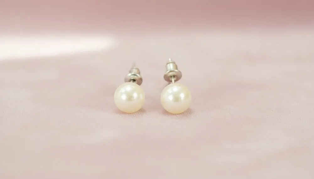Classic Pearl Stud Earrings sold by Charming Charlie