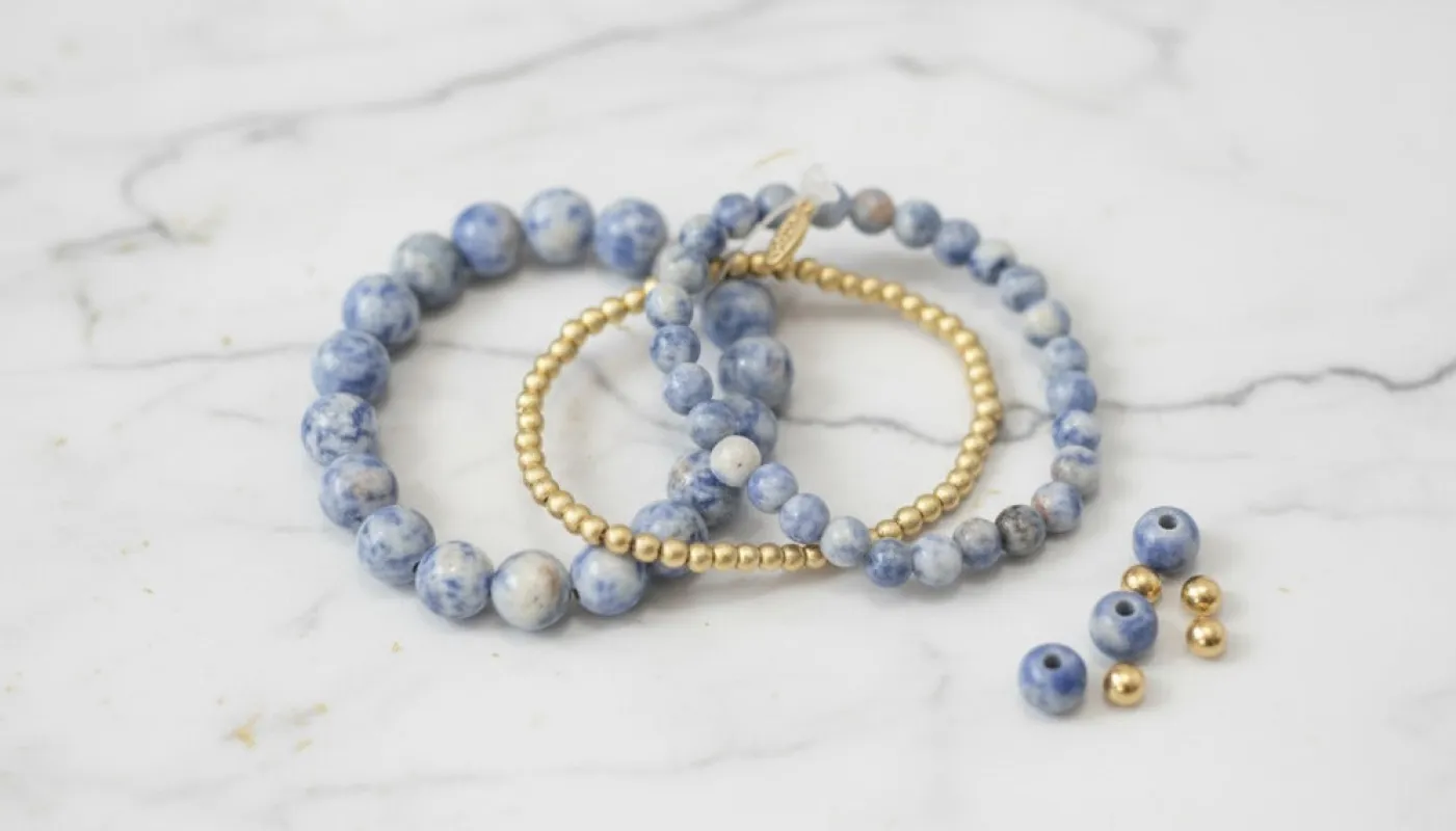 Blue Gemstone and Gold Bead Bracelets sold by Charming Charlie