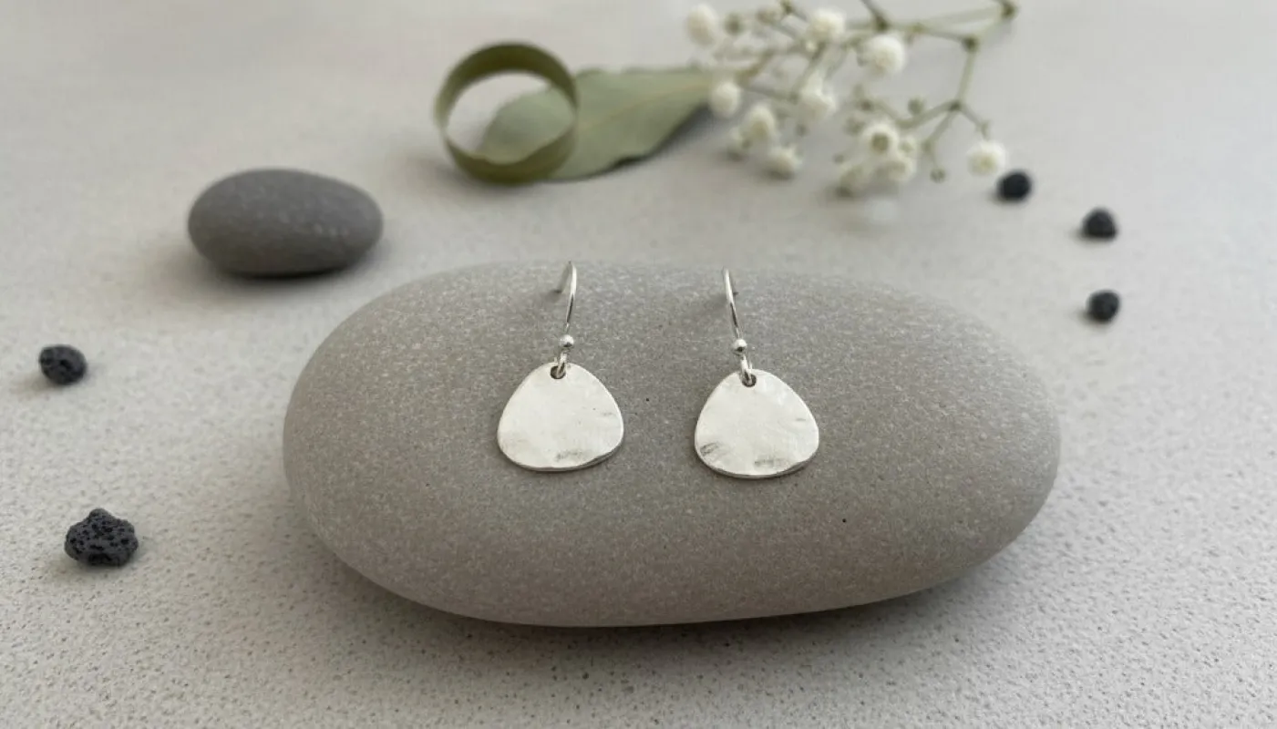 Silver Hammered Tear Drop Earrings sold by Charming Charlie