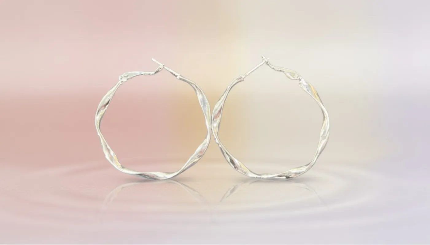 Silver Twisted Metal Hoop Earring sold by Charming Charlie