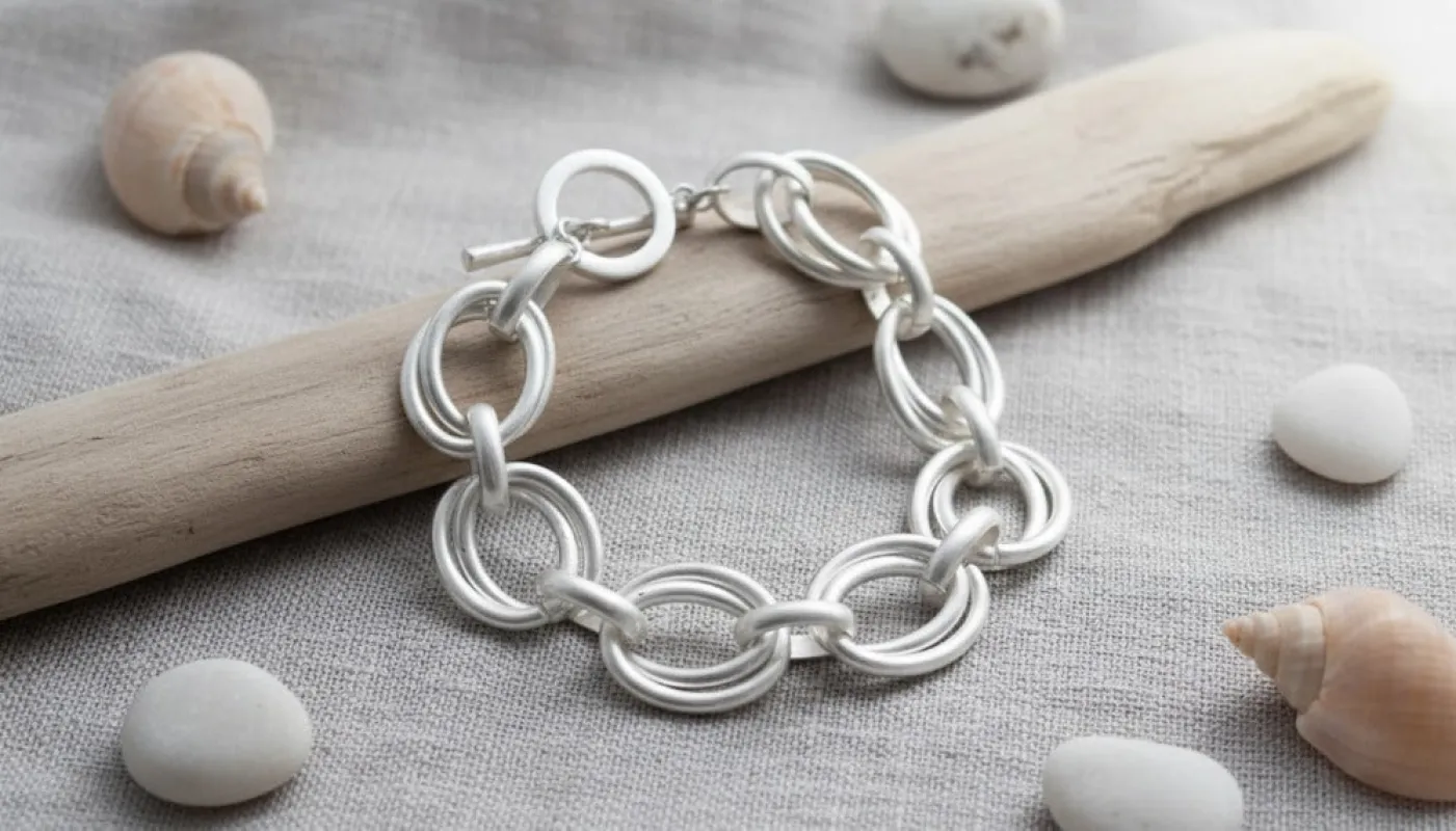 Silver Link Bracelet Featuring Interlocking Circles sold by Charming Charlie