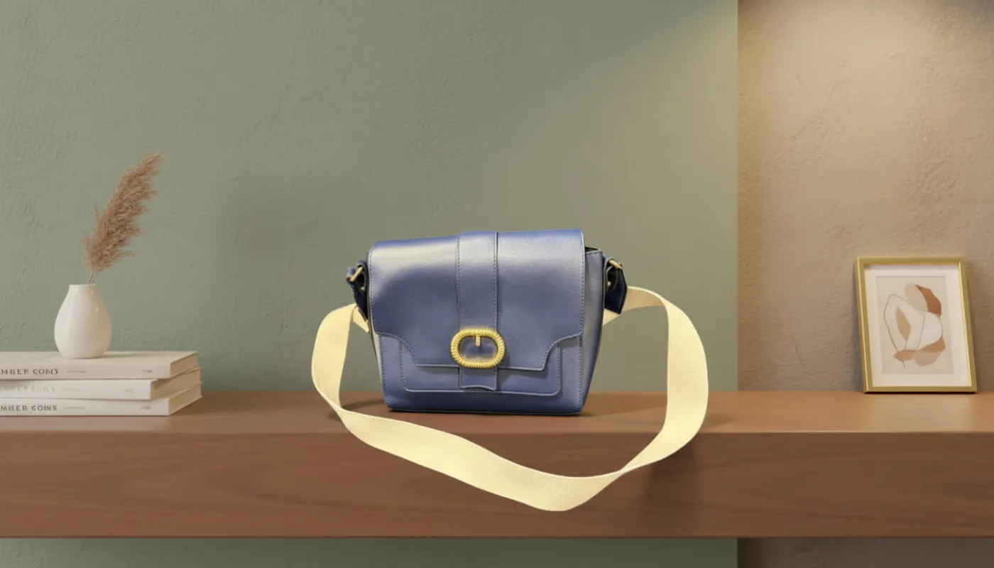 Blue Leather Crossbody Bag with a Gold Buckle and Cream Strap sold by Charming Charlie