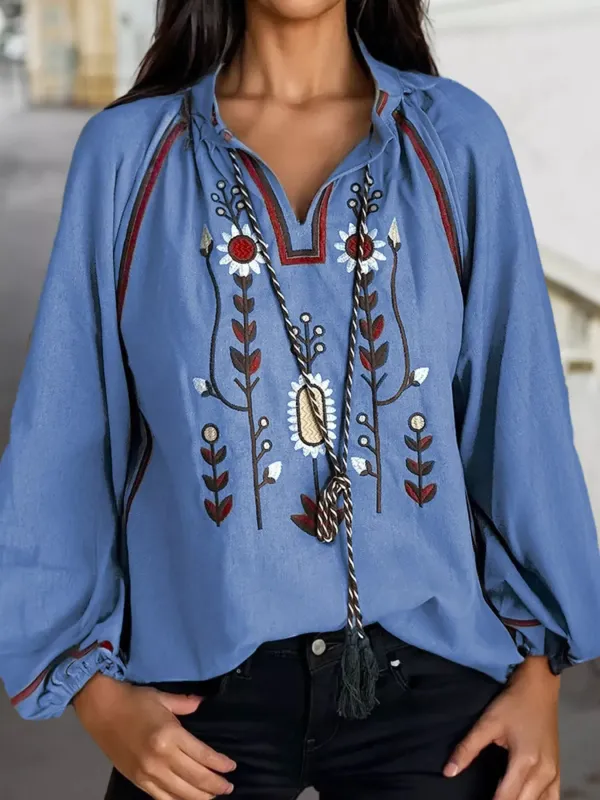 Floral Embroidered Split Neck Tassel Tie Puff Sleeve Blouse sold by Charming Charlie