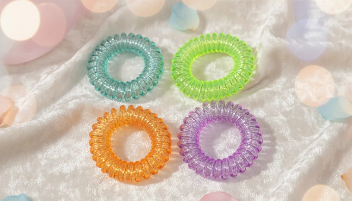 Colorful Spiral Hair Ties. Pack of 4 sold by Charming Charlie