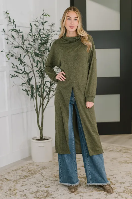 Travel City Scape Turtle Neck Tunic in Olive sold by Charming Charlie