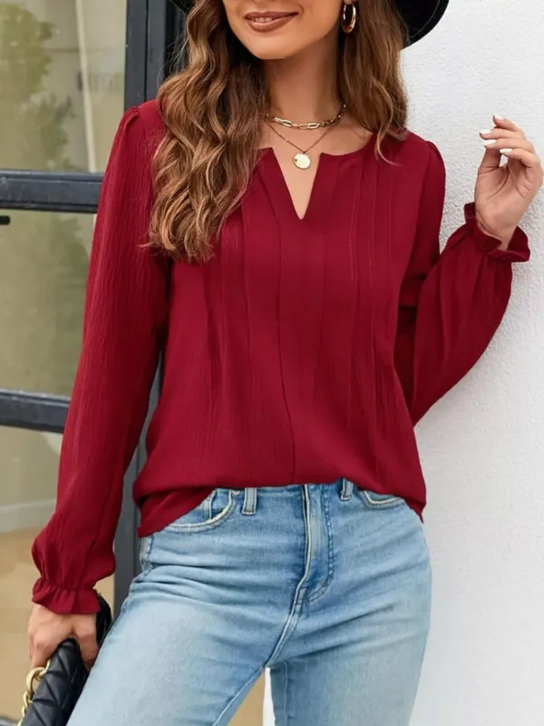 Notched Ruffle Cuff Blouse sold by Charming Charlie
