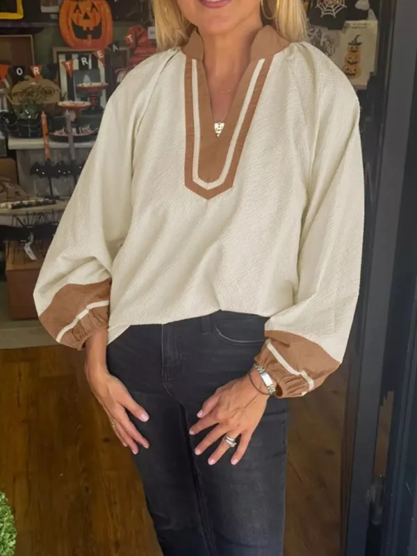 Contrast Notched Balloon Sleeve Blouse sold by Charming Charlie
