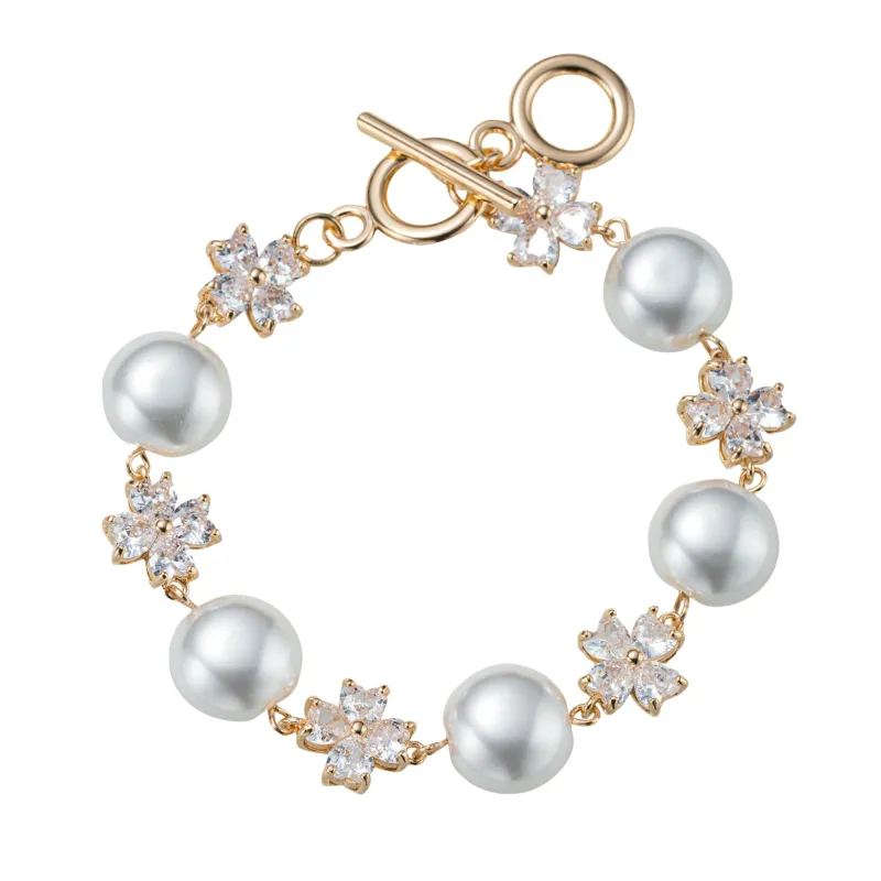 Clear, Pearl Flower Link Toggle Bracelet sold by Charming Charlie