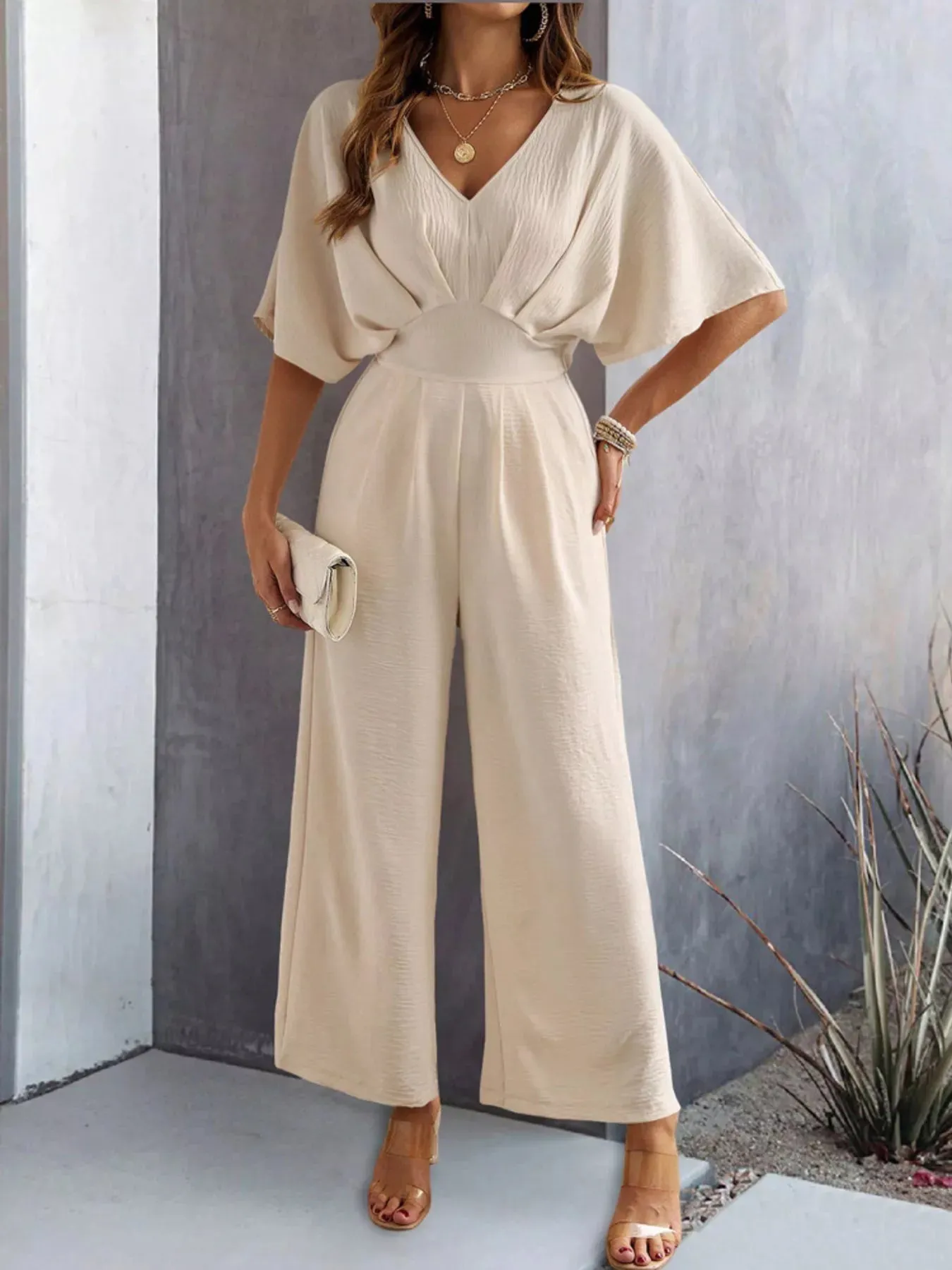 V-Neck Wide Leg Jumpsuit sold by Charming Charlie