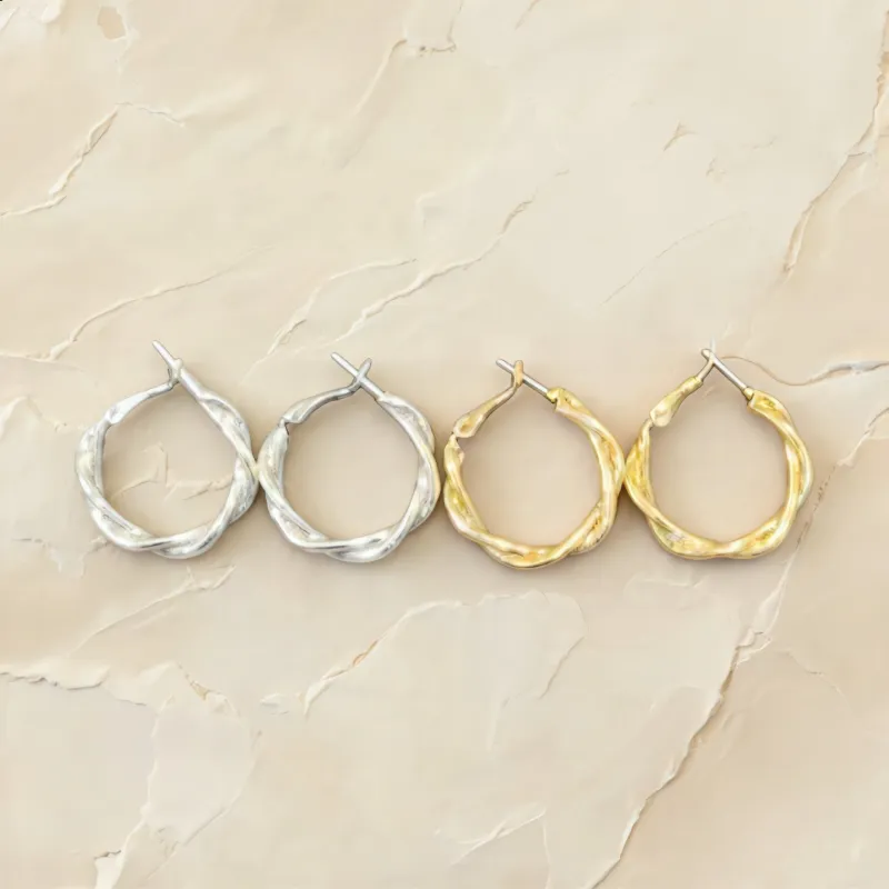 Textured Silver and Gold Twisted Hoop Earrings made by Charming Charlie