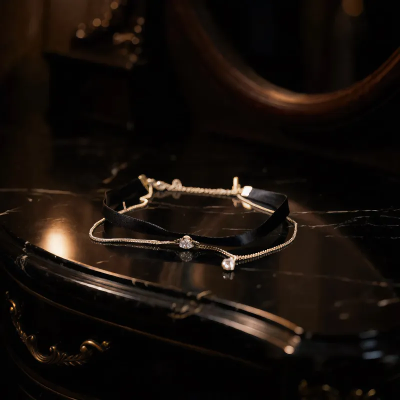 Black Ribbon and Gold Chain Choker sold by Charming Charlie