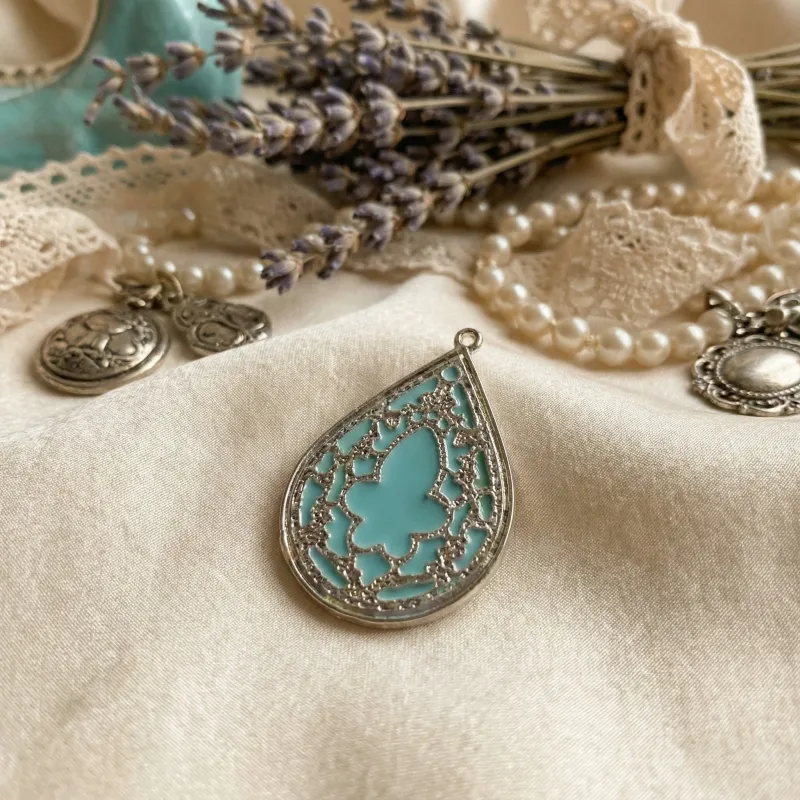 Elegant Vintage-Style Teardrop Filigree Pendant sold by Charming Charlie