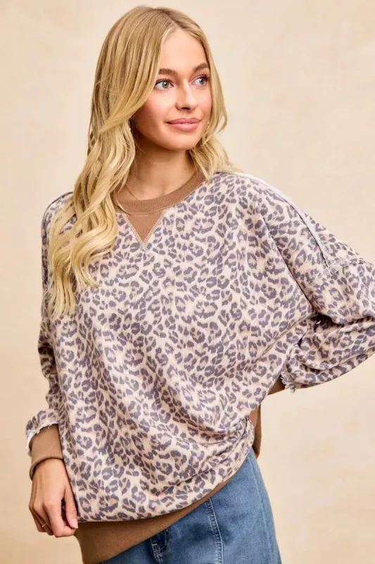 BiBi Leopard Printed French Terry Sweatshirt sold by Charming Charlie