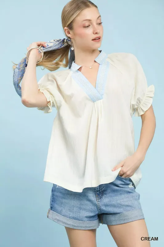 Umgee Textured V-Neck Top with Lace Trim Details sold by Charming Charlie