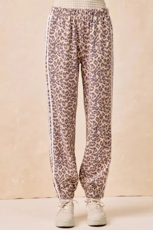 BiBi Side Lines Leopard Track Pants sold by Charming Charlie