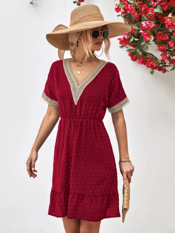 V-Neck Swiss Dot Ruffle Hem Mini Dress sold by Charming Charlie