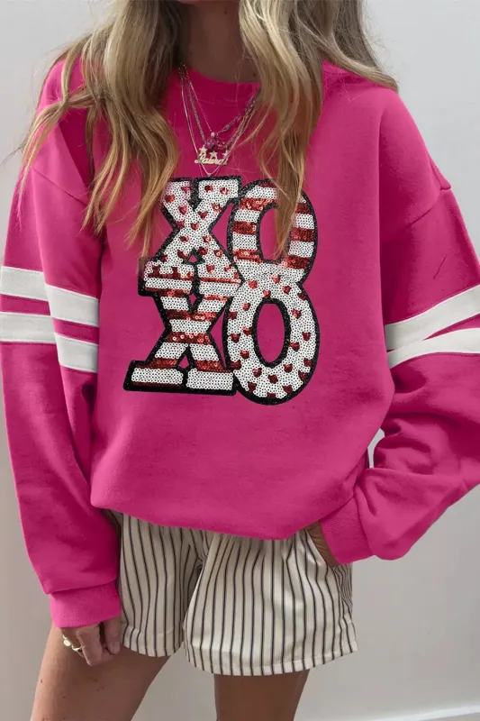 Oversized Varsity Drop Shoulder Sequined XOXO Valentine Sweatshirt sold by Charming Charlie