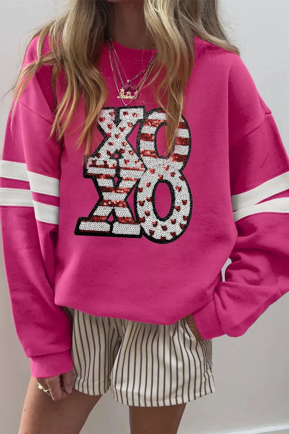 Oversized Varsity Drop Shoulder Sequined XOXO Valentine Sweatshirt sold by Charming Charlie