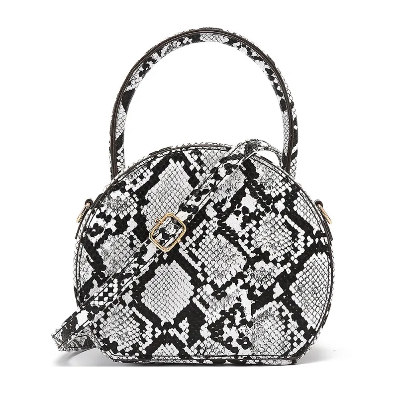 Snake Skin Print Crossbody sold by Charming Charlie