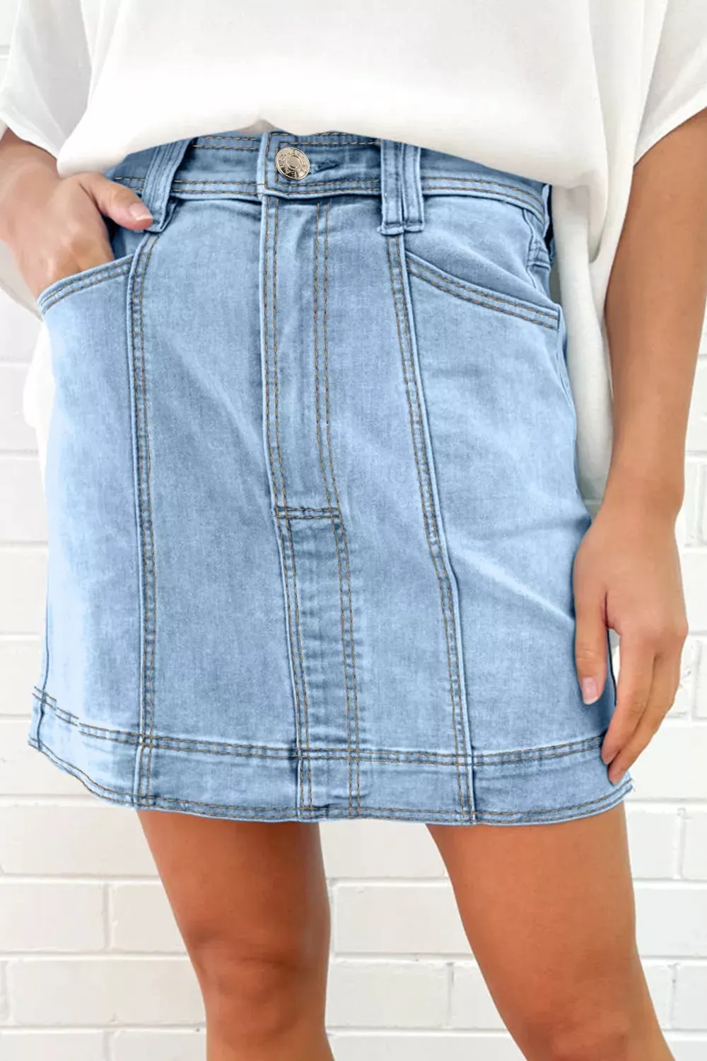 Exposed Seam Detail A-line Denim Mini Skirt with Pockets sold by Charming Charlie