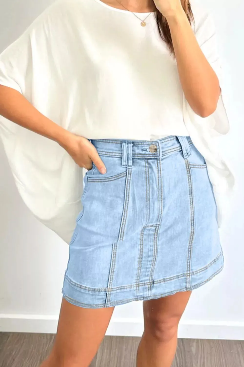Exposed Seam Detail A-line Denim Mini Skirt with Pockets sold by Charming Charlie product image thumbnail 2