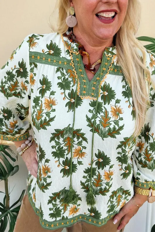 Plus Size Floral Printed Contrast Patchwork Detail Tassel Tie 3/4 Sleeve Blouse sold by Charming Charlie