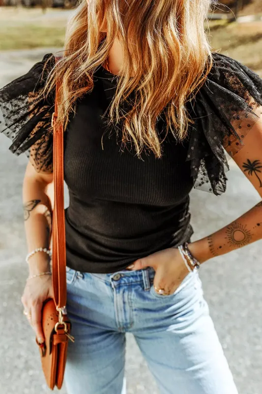 Polka Dot Mesh Sleeve Ribbed Top sold by Charming Charlie