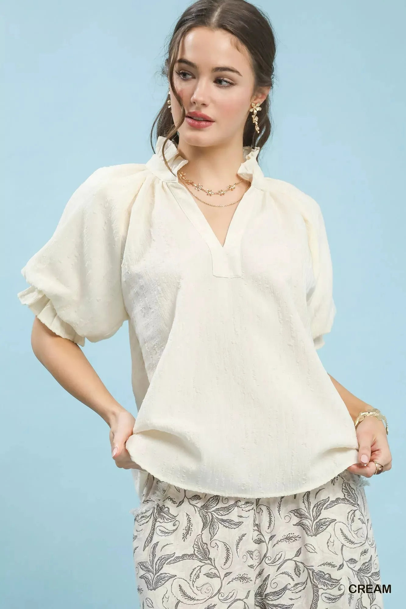 Umgee Textured Puff Sleeve Split Neck Top sold by Charming Charlie