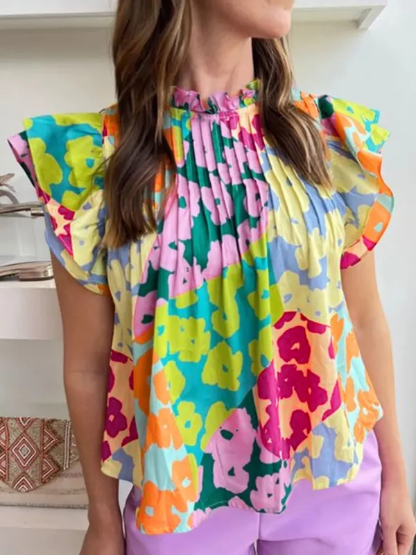 Printed Ruffled Cap Sleeve Blouse sold by Charming Charlie