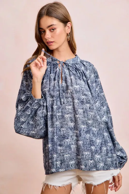 BiBi Ribbon Bow Print Exaggerated Balloon Sleeves Top sold by Charming Charlie