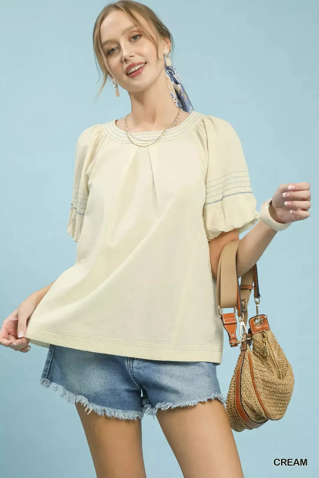 Umgee Round Neck Puff Sleeve Top with Contrast Stitch Detail sold by Charming Charlie