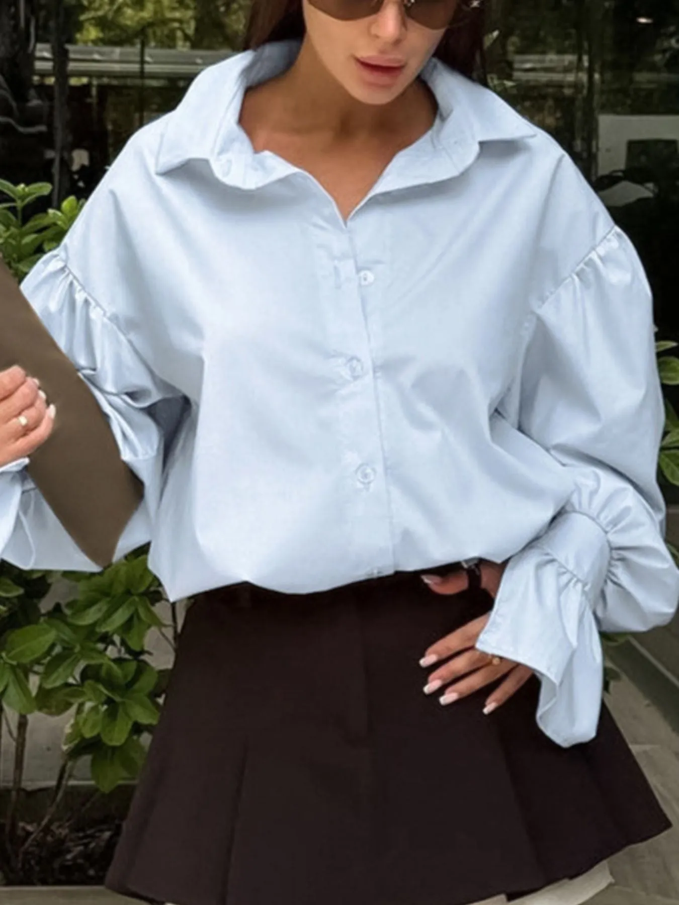 Button-Down Flounce Sleeve Shirt sold by Charming Charlie