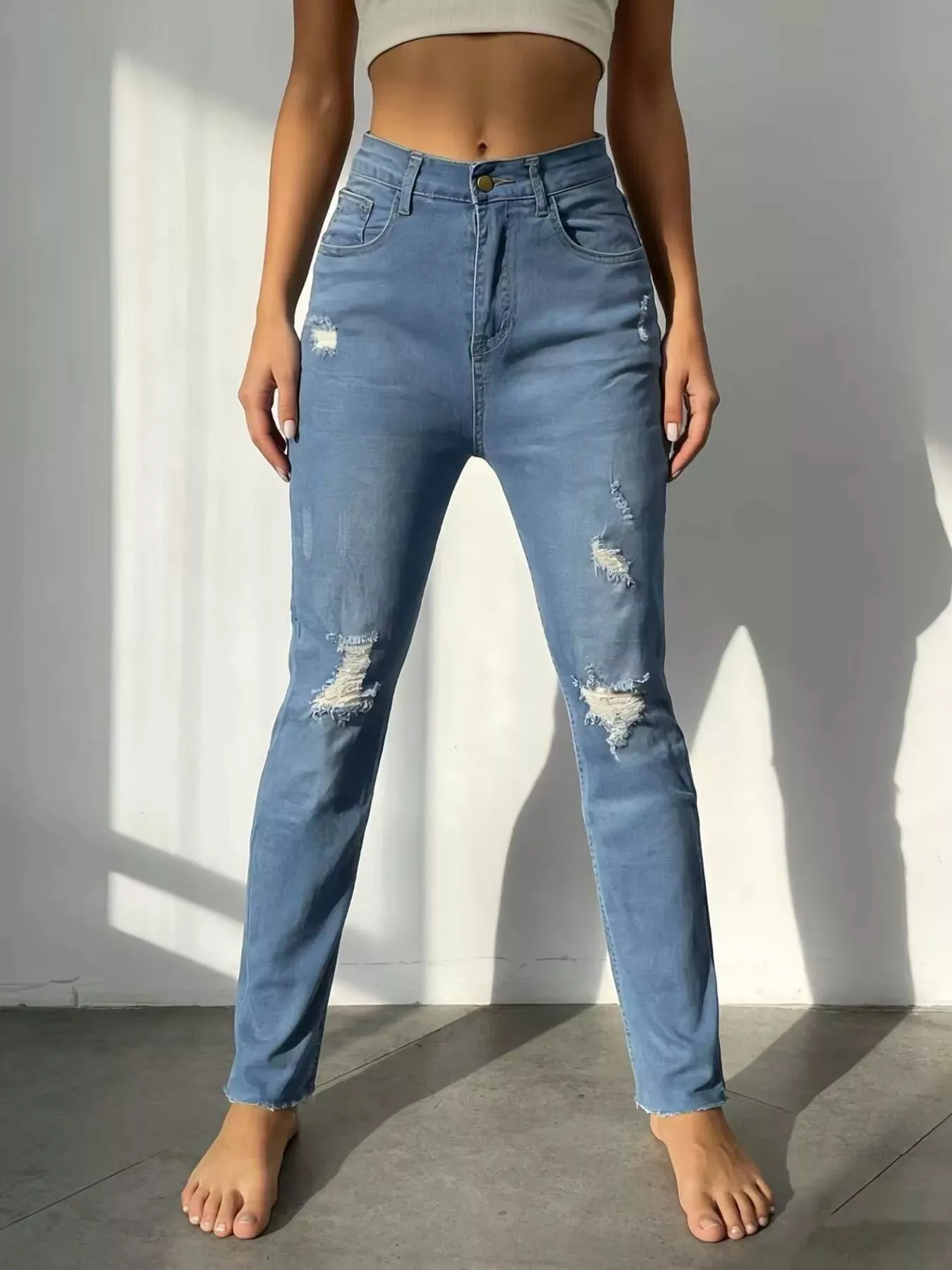 High-Waisted Distressed Jeans sold by Charming Charlie