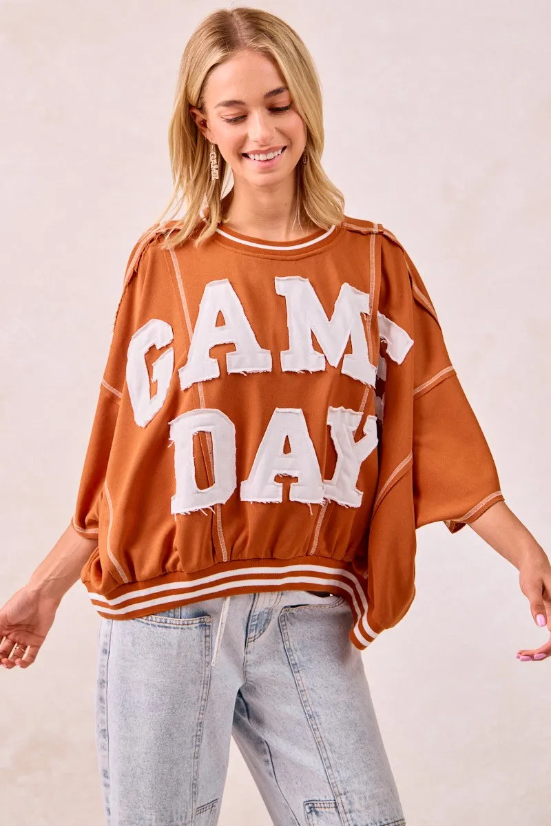 BiBi Gameday Patchwork Stitch Detail French Terry Top sold by Charming Charlie