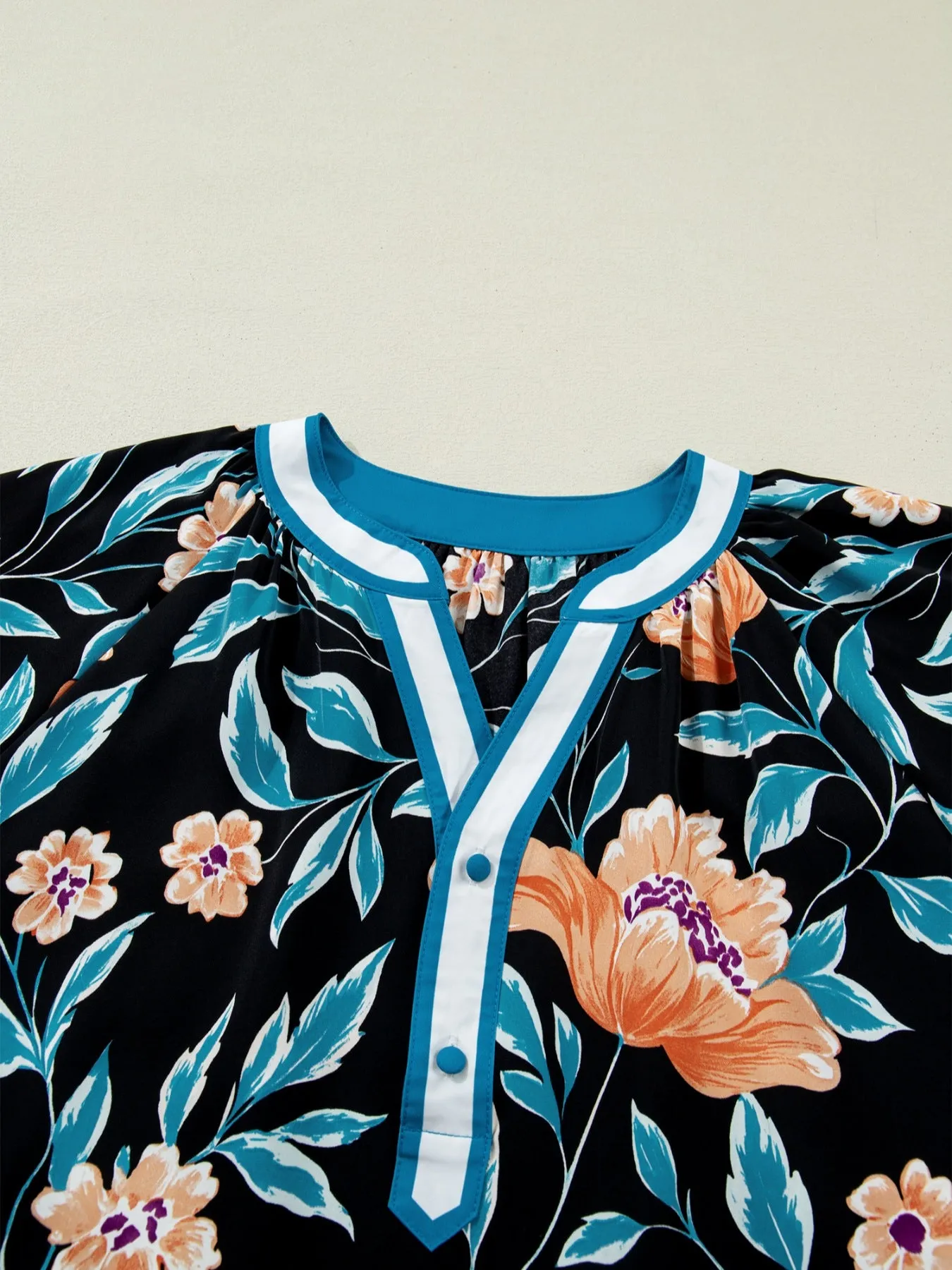 Floral Short Bubble Sleeve Buttoned Notched Neck Blouse sold by Charming Charlie product image thumbnail 5