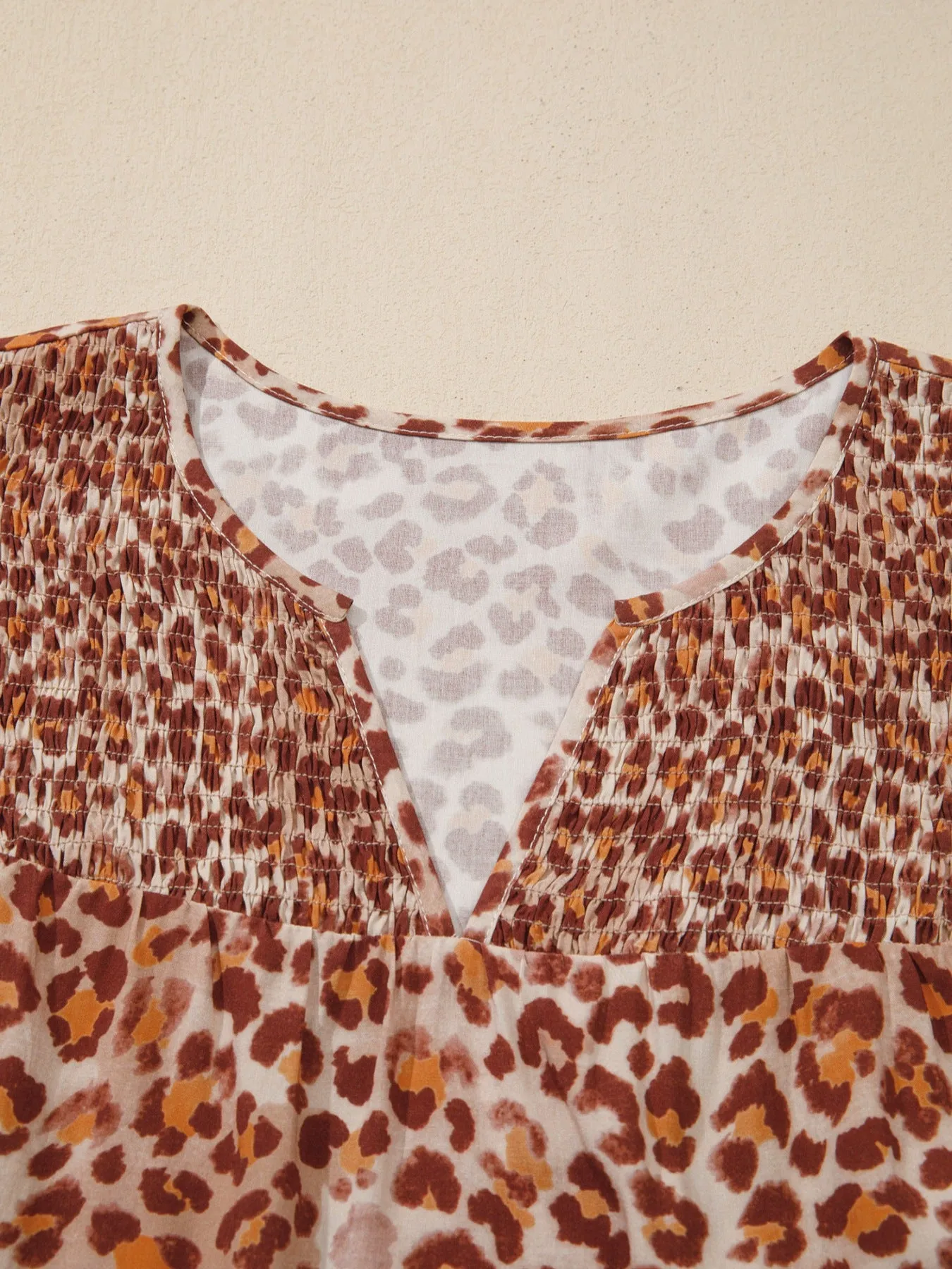 Leopard Print Smocked Notched Blouse sold by Charming Charlie product image thumbnail 5