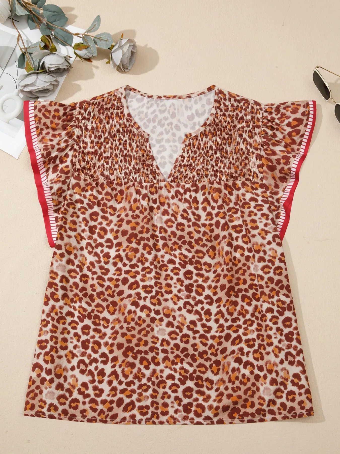 Leopard Print Smocked Notched Blouse sold by Charming Charlie product image thumbnail 3
