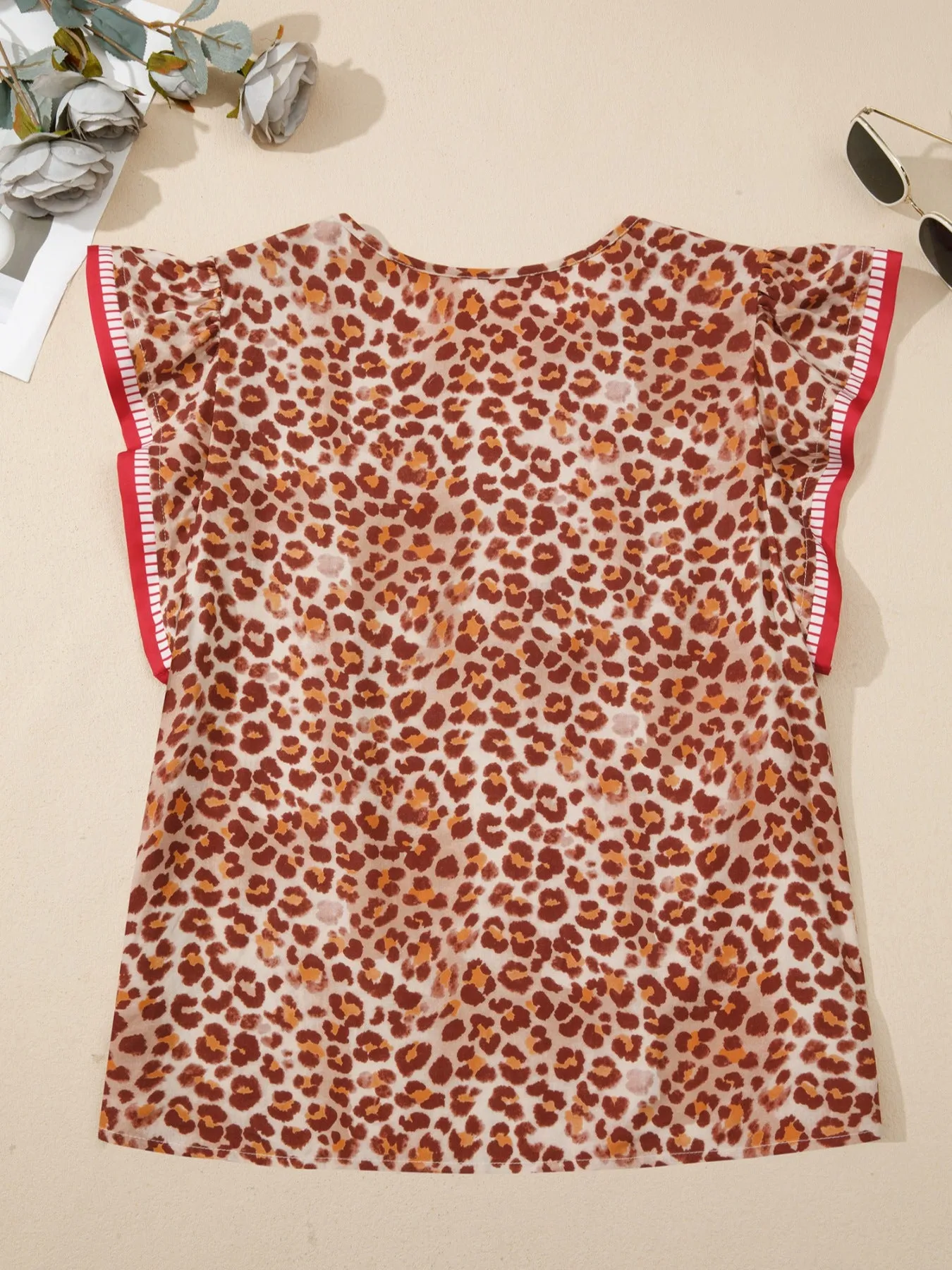 Leopard Print Smocked Notched Blouse sold by Charming Charlie product image thumbnail 4