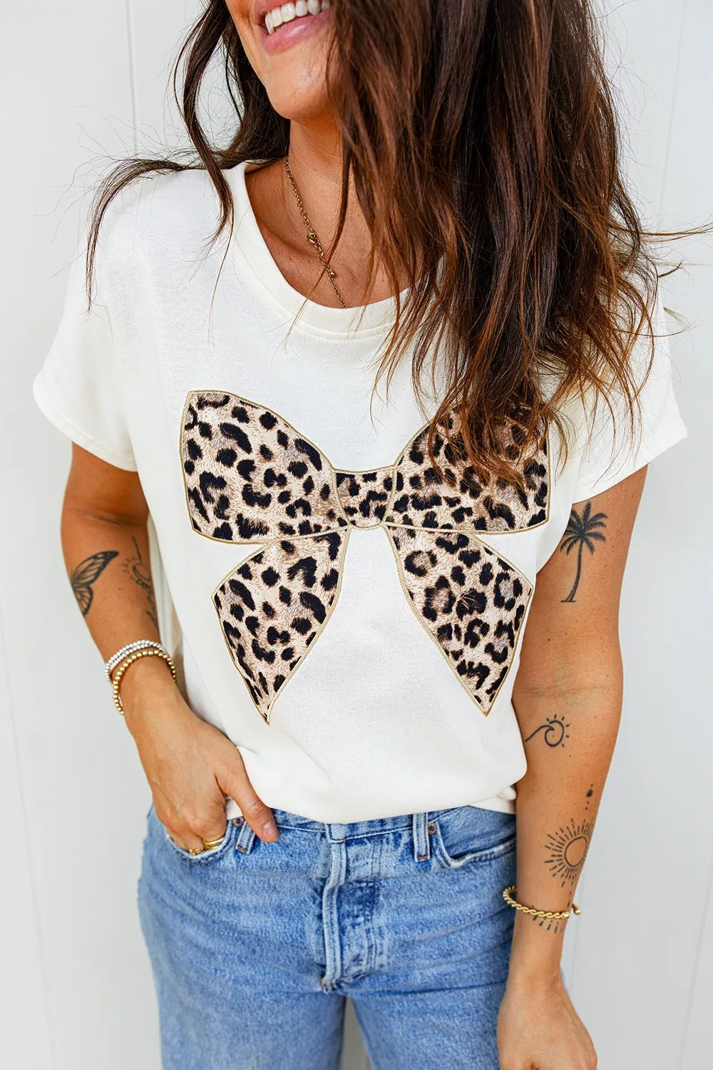 Leopard Bow Graphic Relaxed Fit T-Shirt sold by Charming Charlie