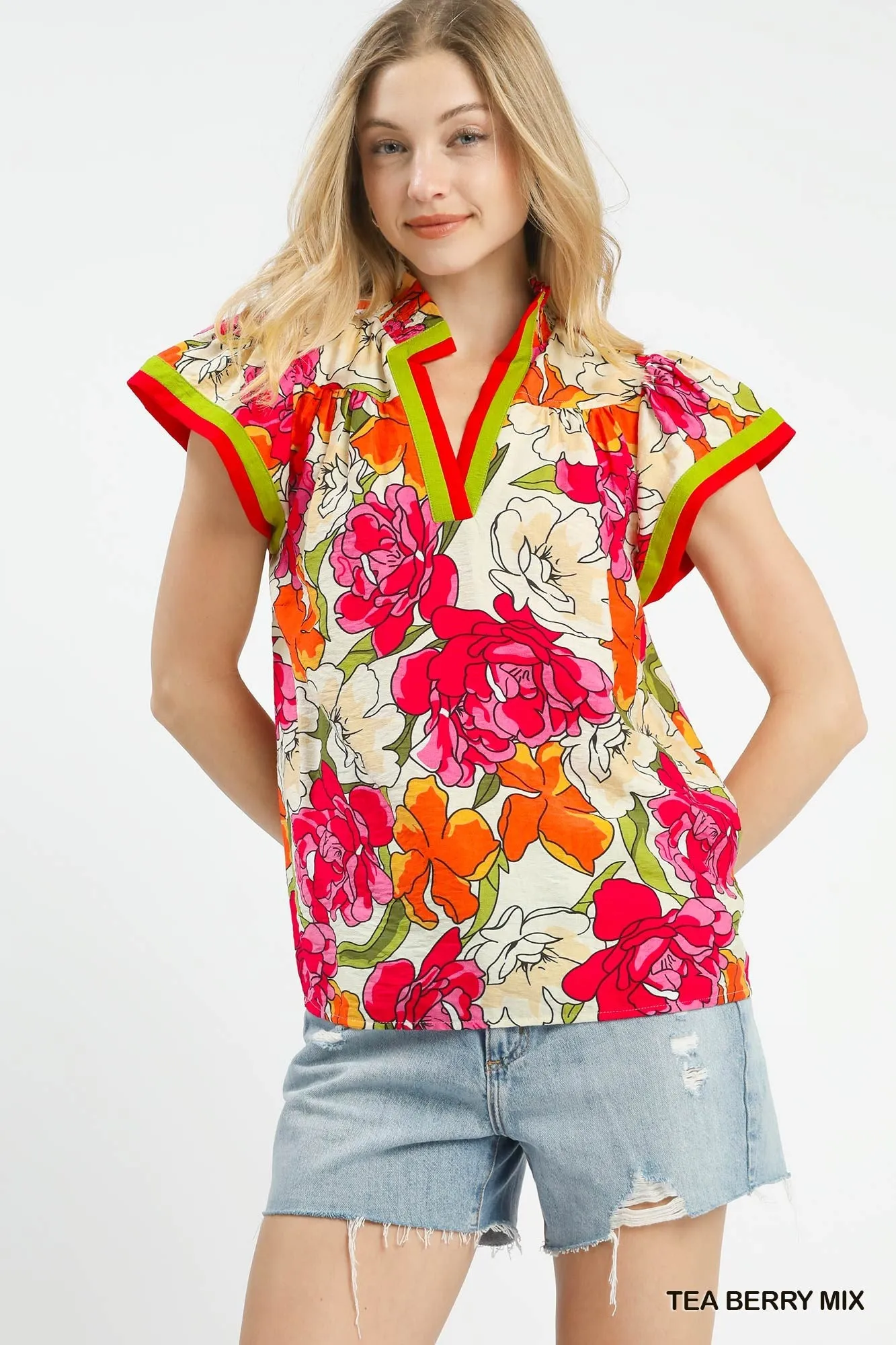 Umgee Floral Print Blouse with Contrast Trim sold by Charming Charlie