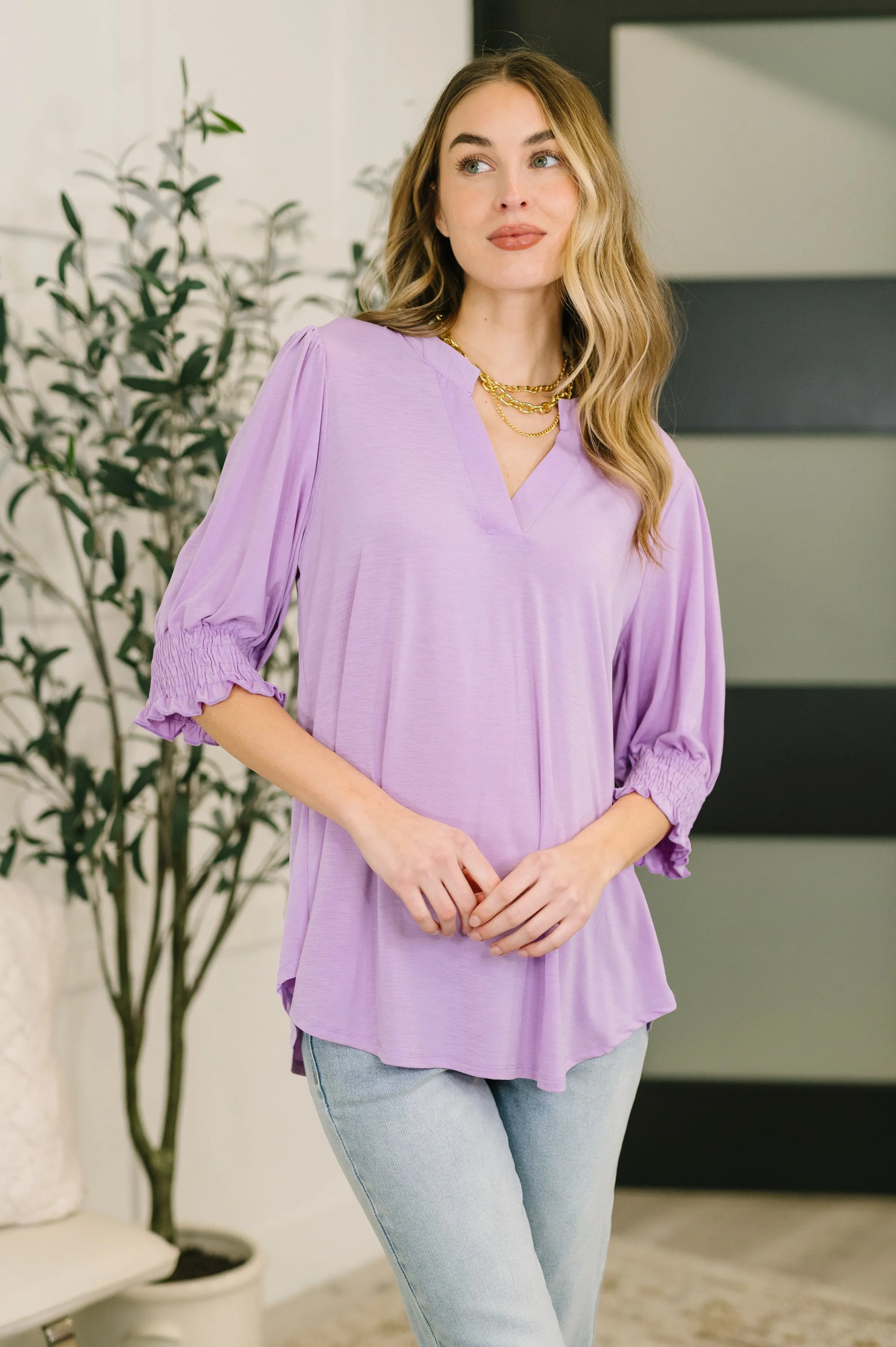 Lizzy Smock Top in Orchid Bloom sold by Charming Charlie