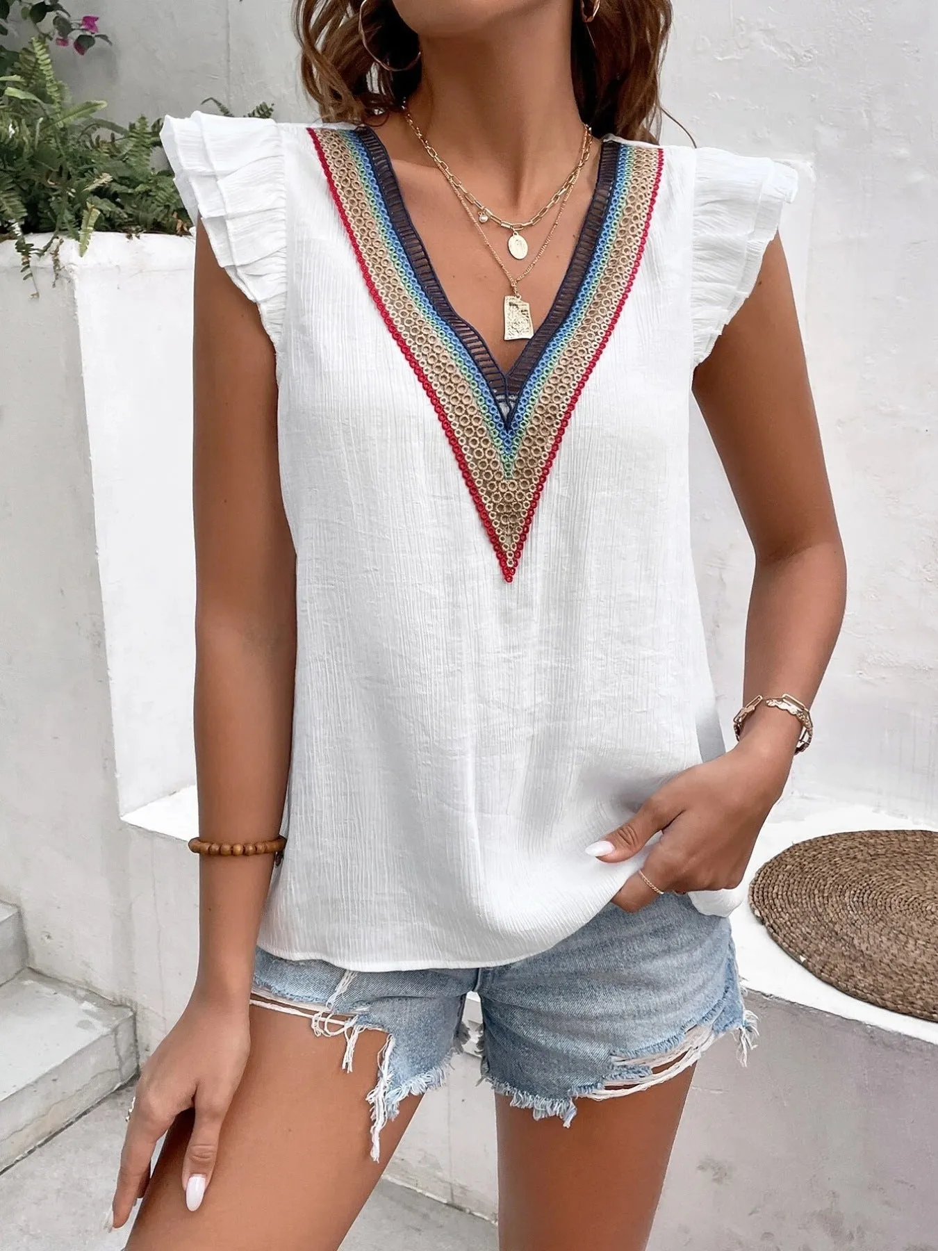 V-Neck Ruffled Cap Sleeve Blouse sold by Charming Charlie