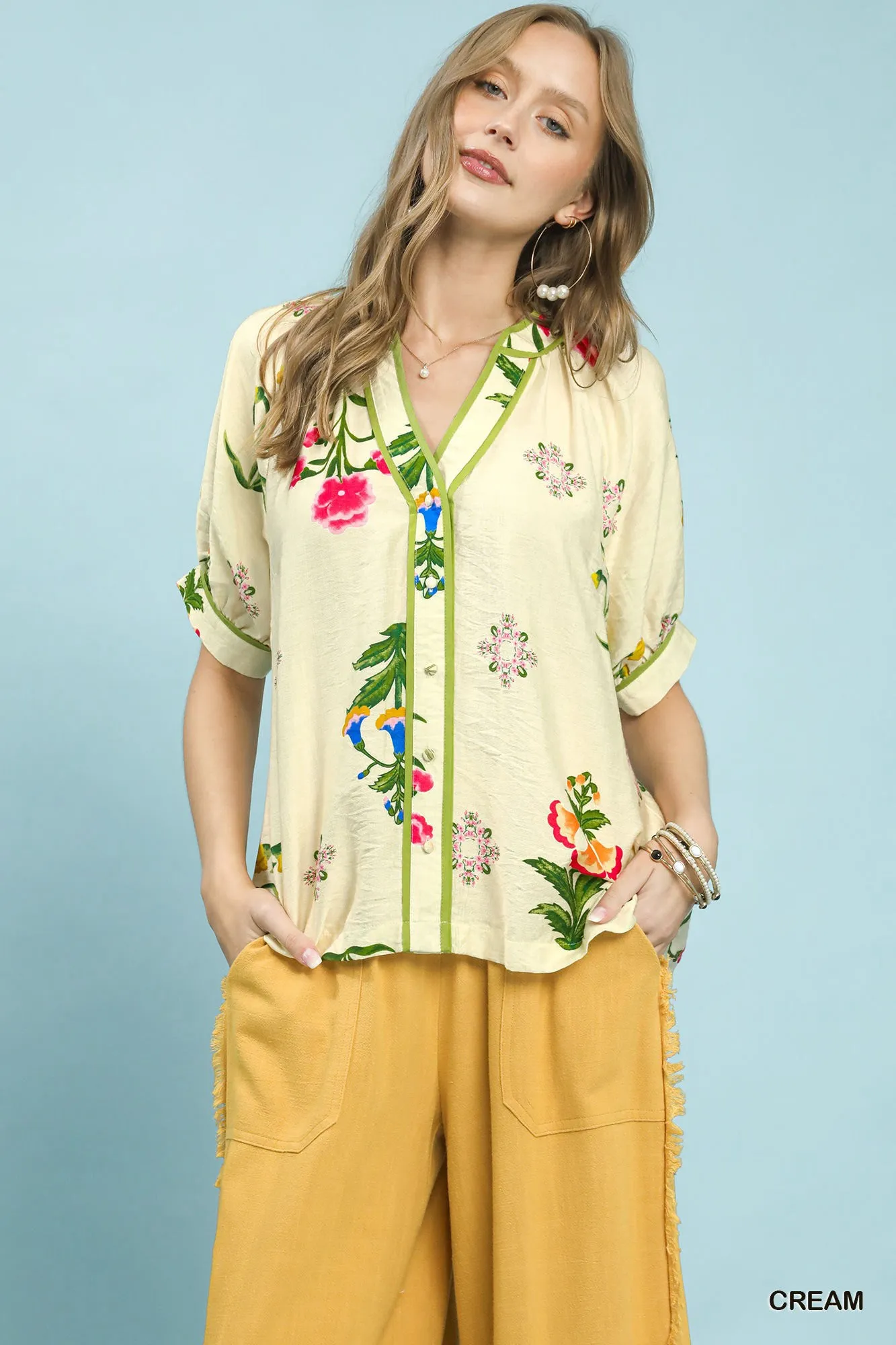 Umgee Botanical Print Contrast Trim Button Blouse sold by Charming Charlie