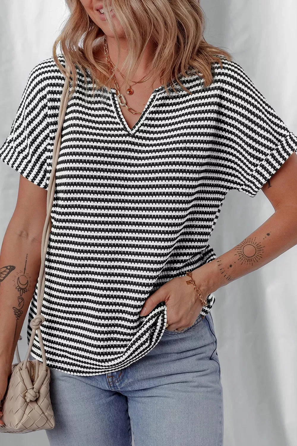 Stripe Textured Knit Notched Neck Cuffed Short Sleeve Top sold by Charming Charlie