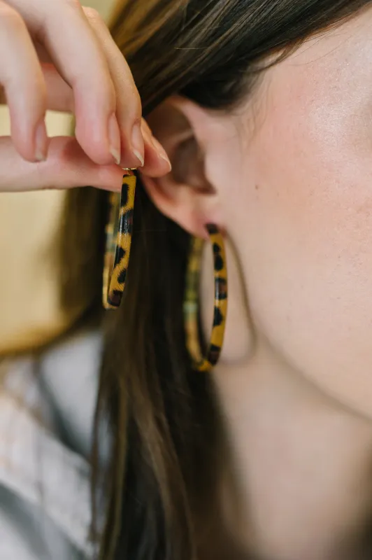 Sassy Assist Leopard Print Hoop Earrings made by Charming Charlie