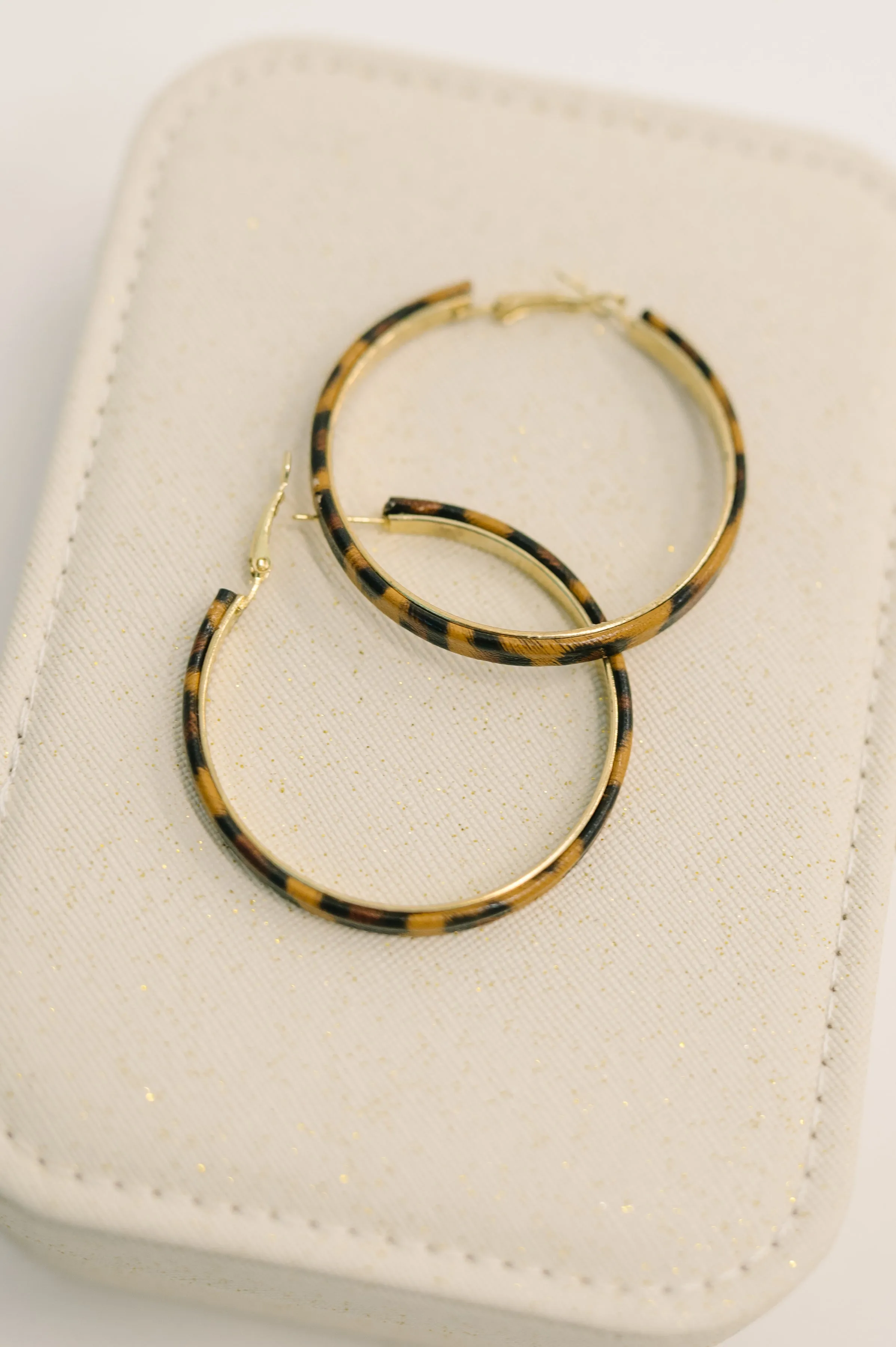 Sassy Assist Leopard Print Hoop Earrings sold by Charming Charlie product image thumbnail 2